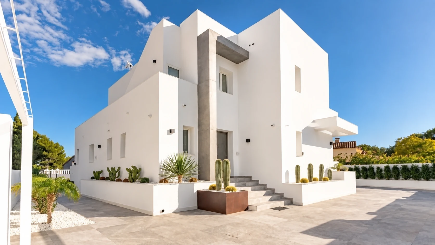 Before: heavily paved villa exterior before the landscape concept